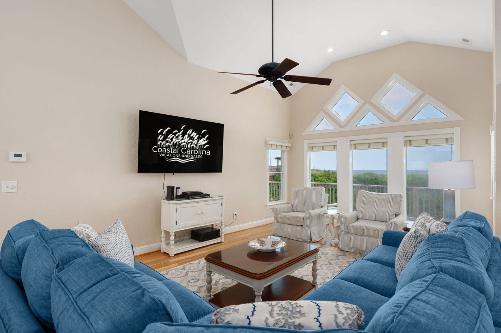 Bright living room with blue sofa.