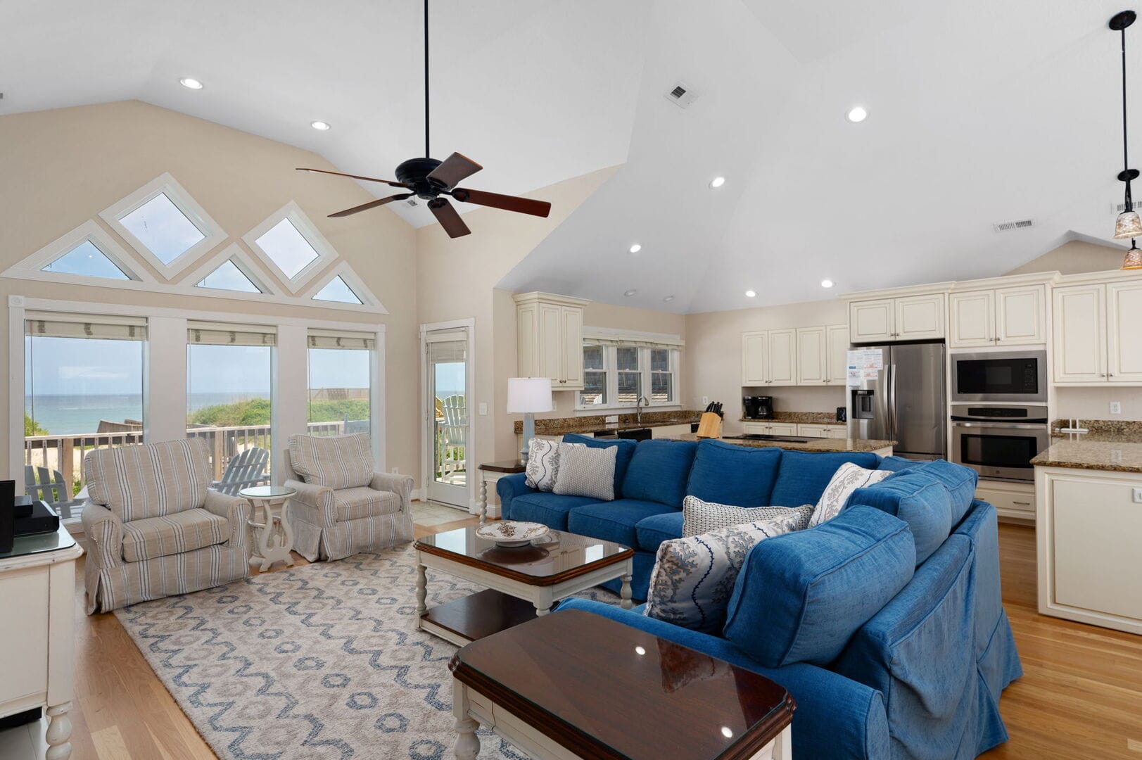 Bright living room with blue sofa.