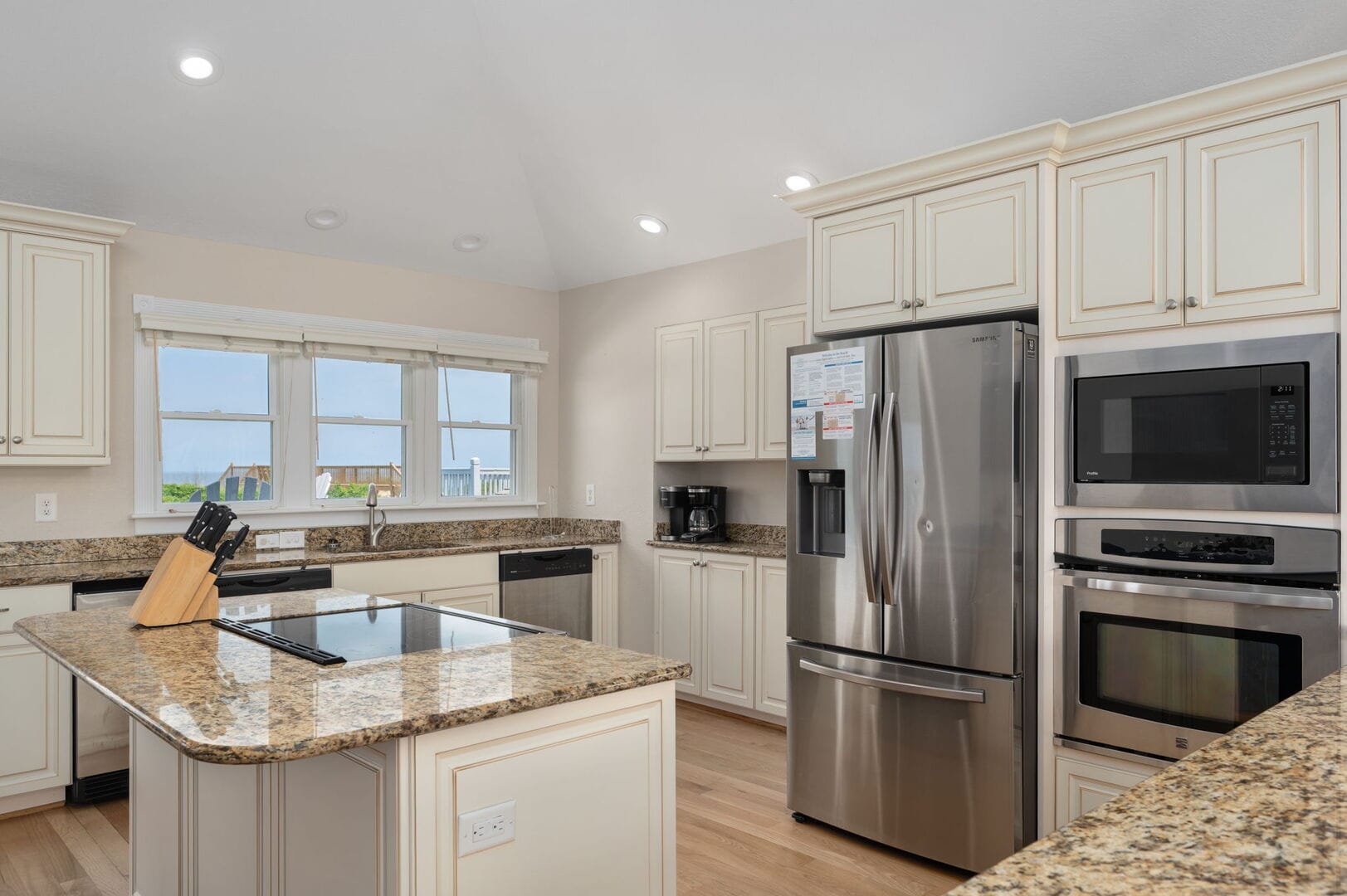 Modern kitchen with stainless appliances.