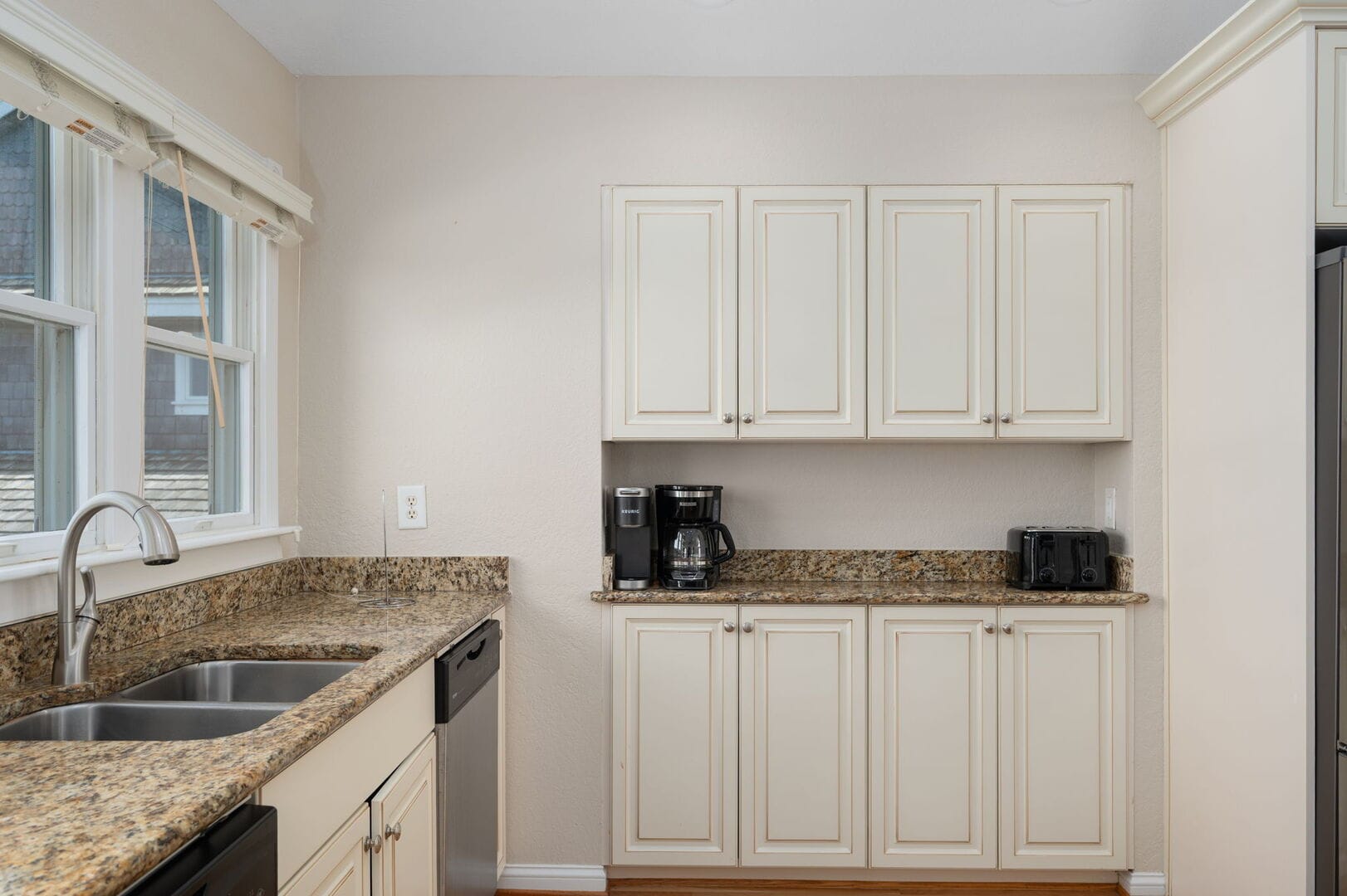 Modern kitchen with appliances and cabinets.