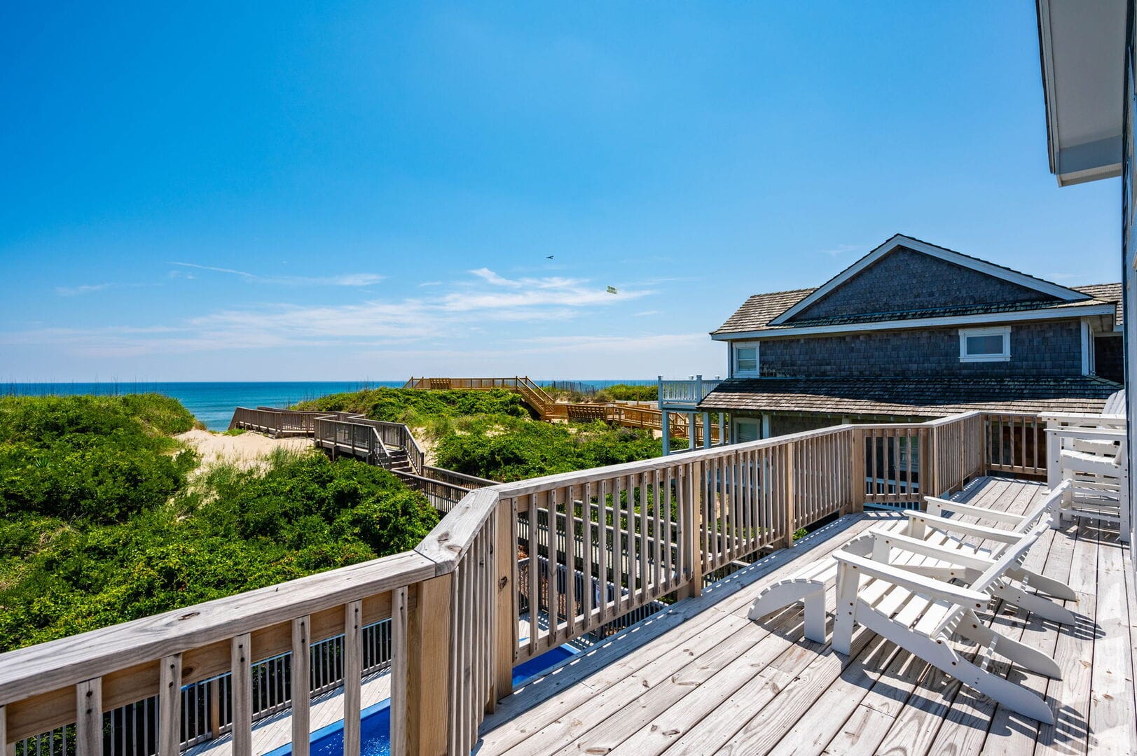 Sunny beach house with deck view.