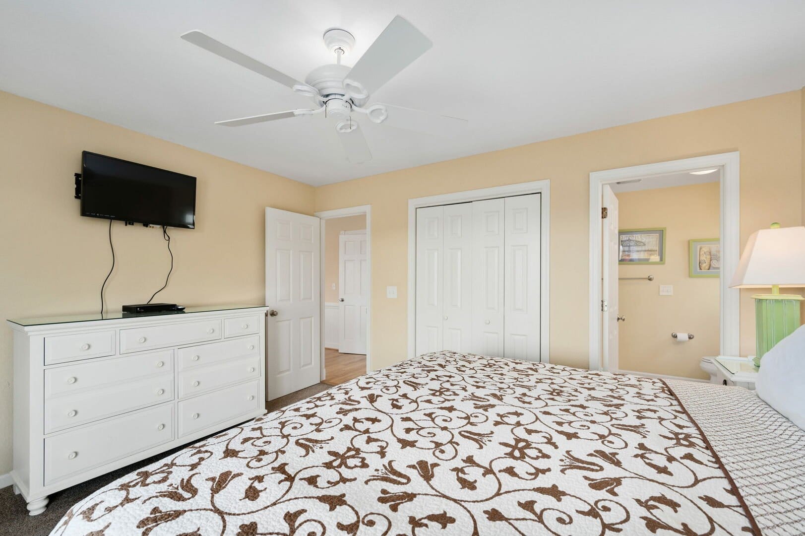 Bedroom with TV and dresser.