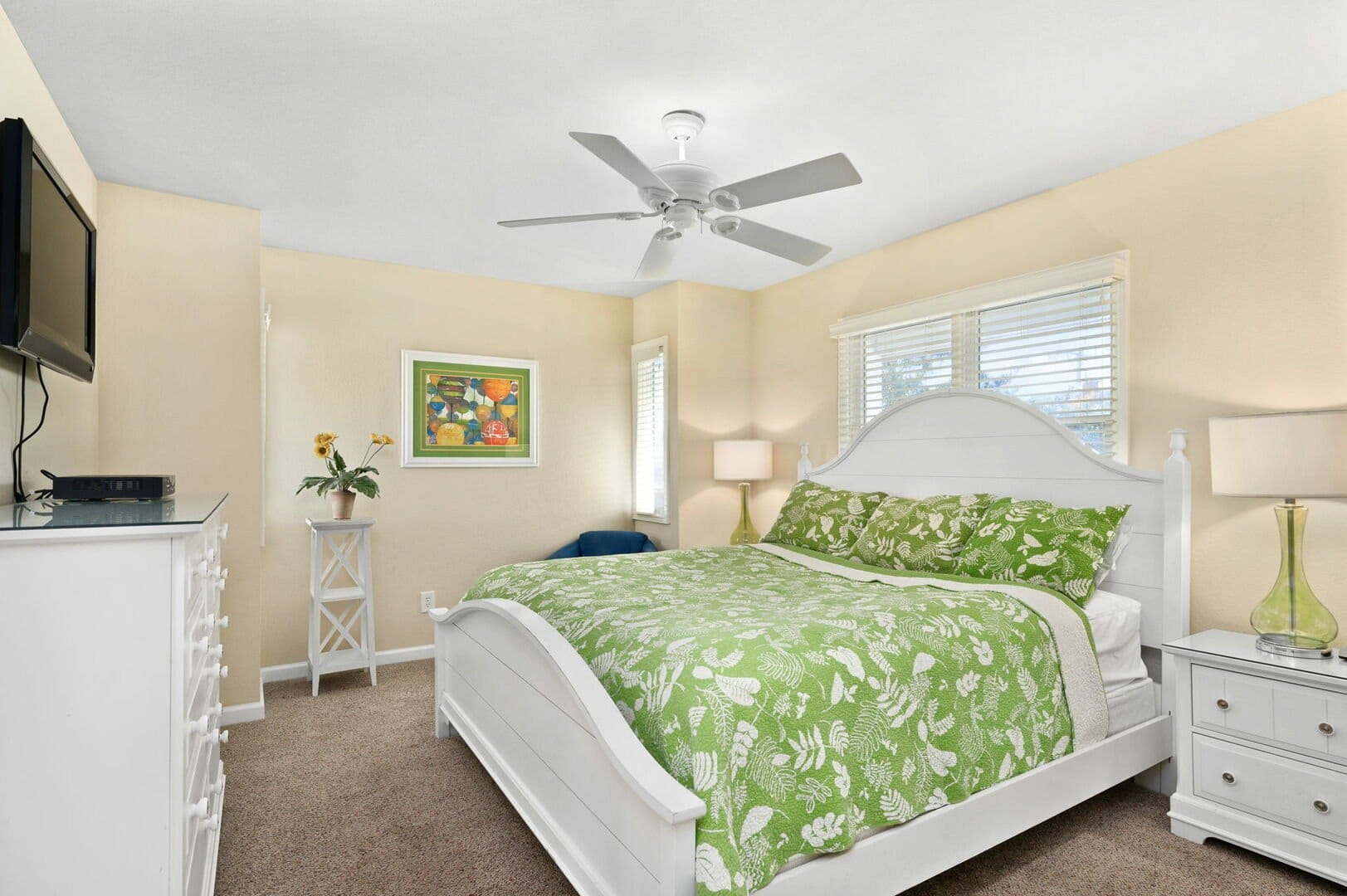 Bright bedroom with green bedding.