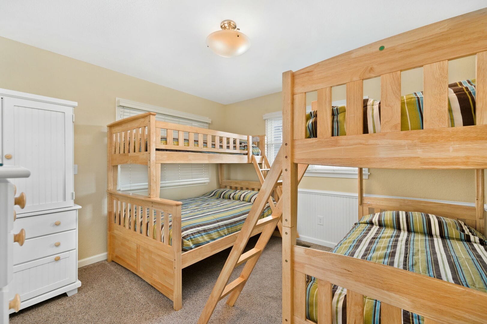 Room with two wooden bunk beds.