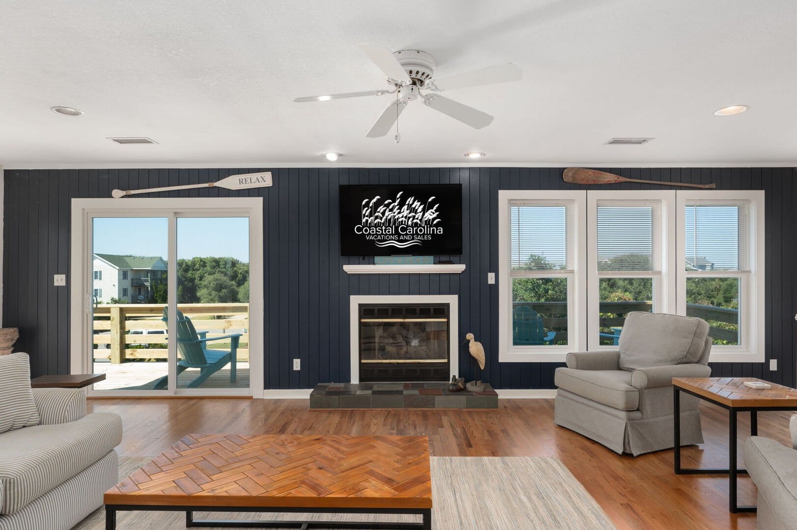 Coastal-themed living room with fireplace.