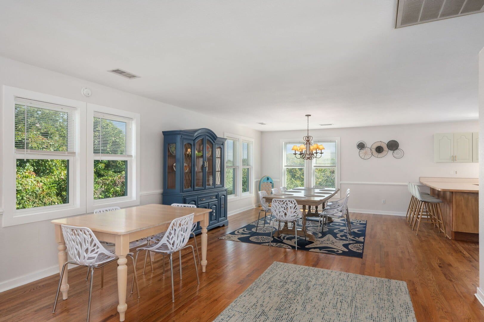 Spacious dining room with two tables.