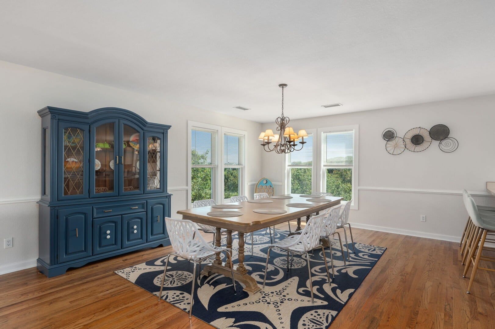 Dining room with blue cabinet.