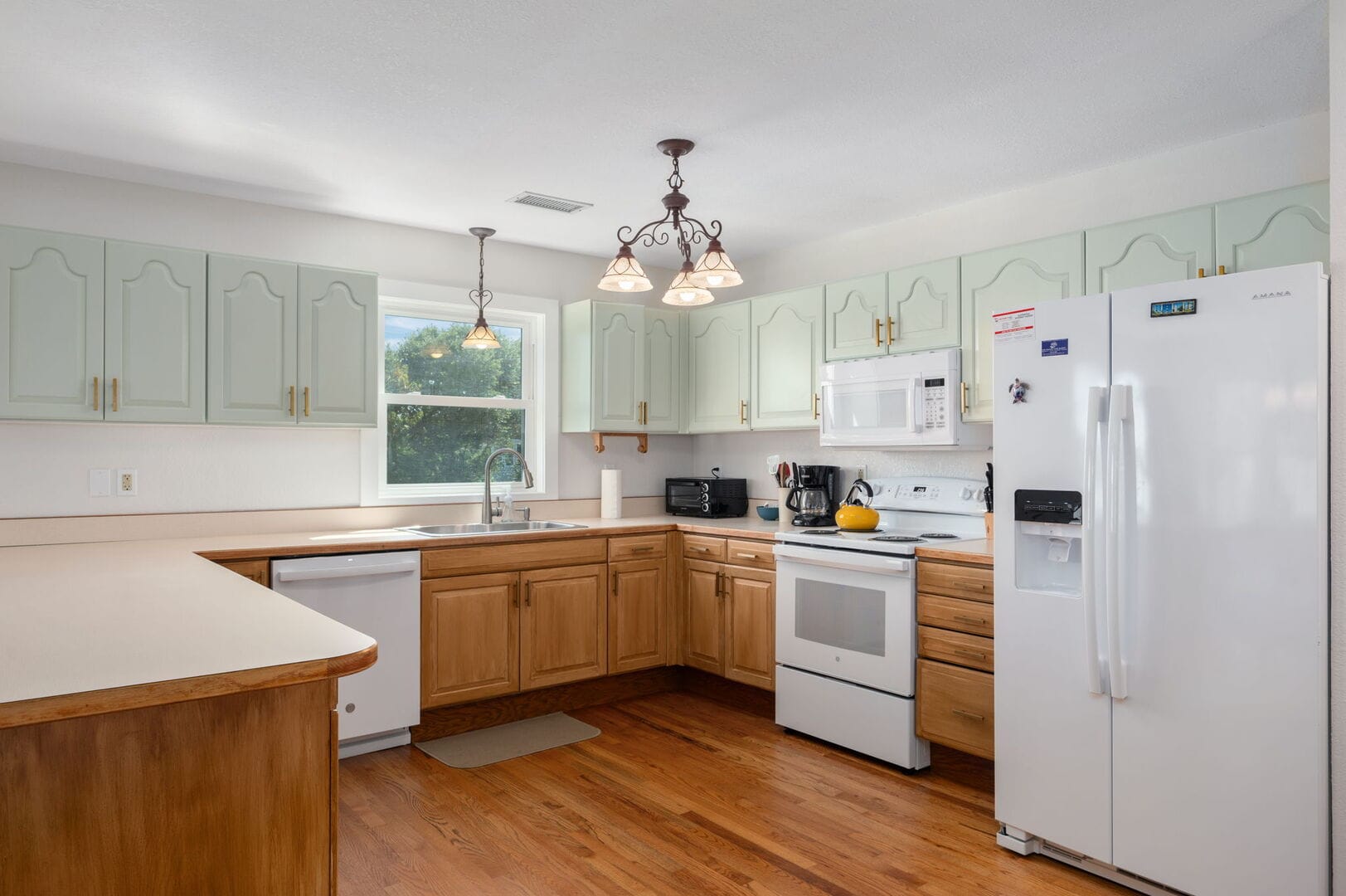 Spacious kitchen with modern appliances.