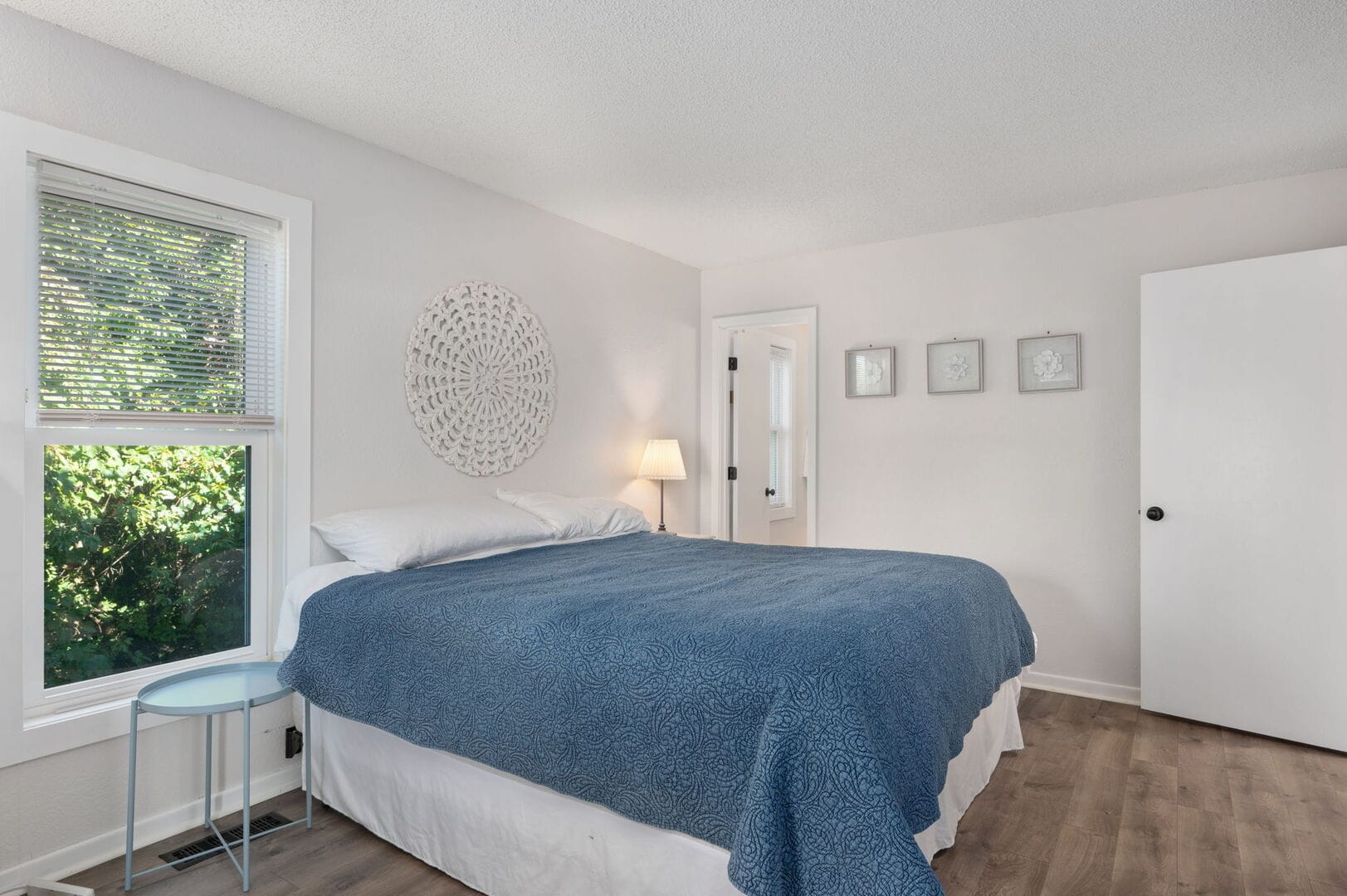 Cozy bedroom with blue bedding.