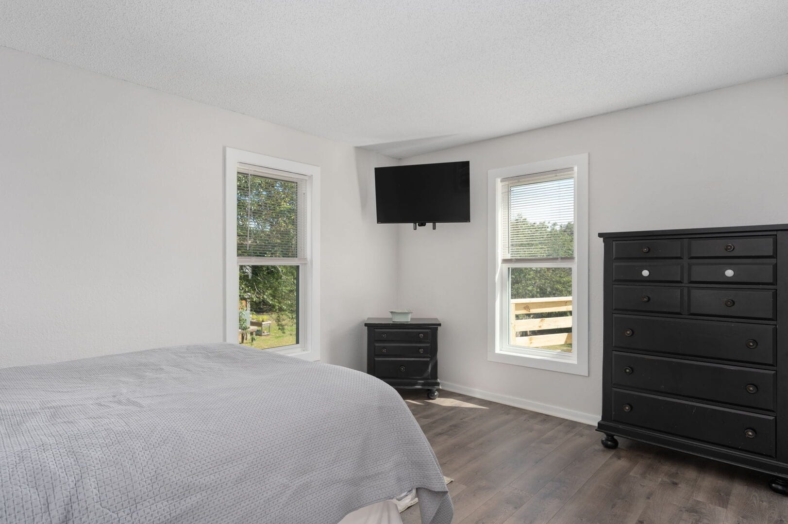 Minimalist bedroom with TV.