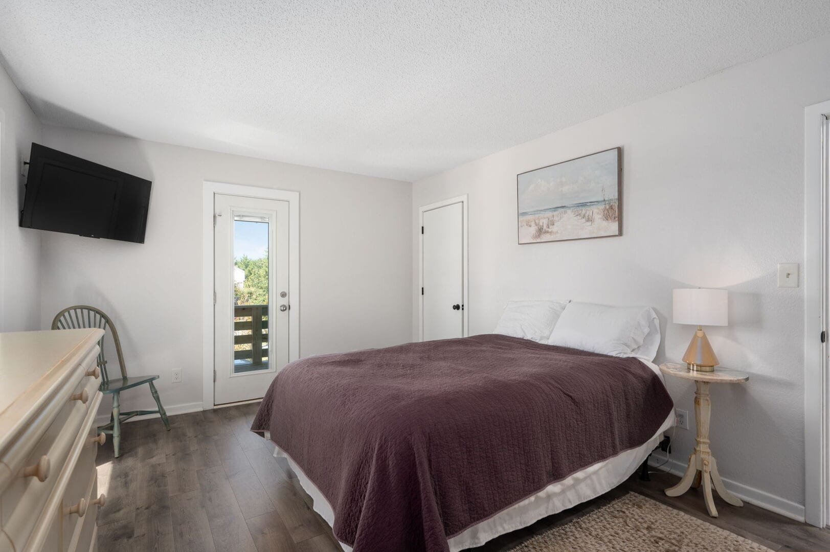 Bedroom with bed and TV.