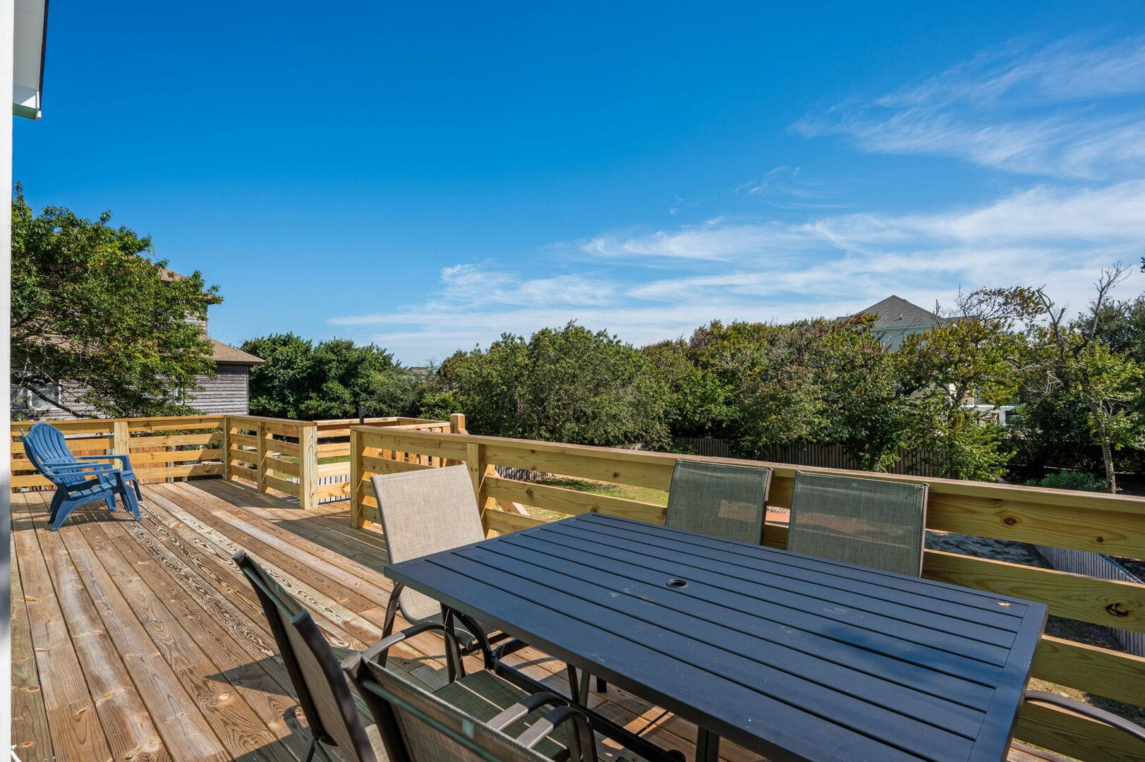 Wooden deck with outdoor furniture.