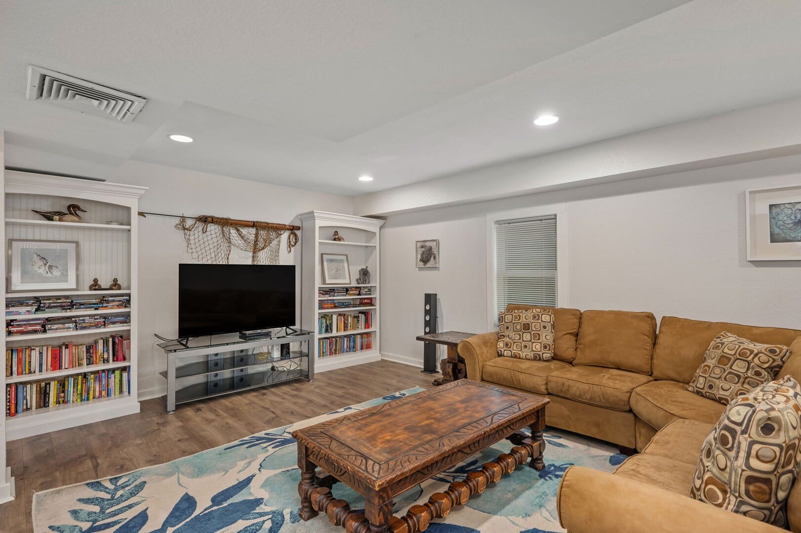 Cozy living room with bookshelves.