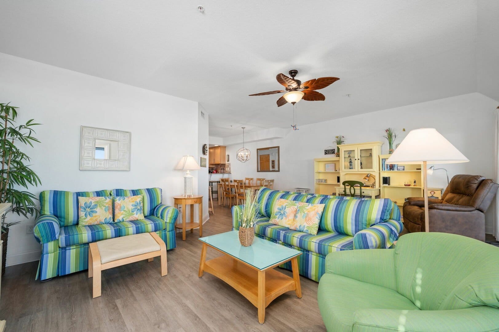 Colorful living room with ceiling fan.