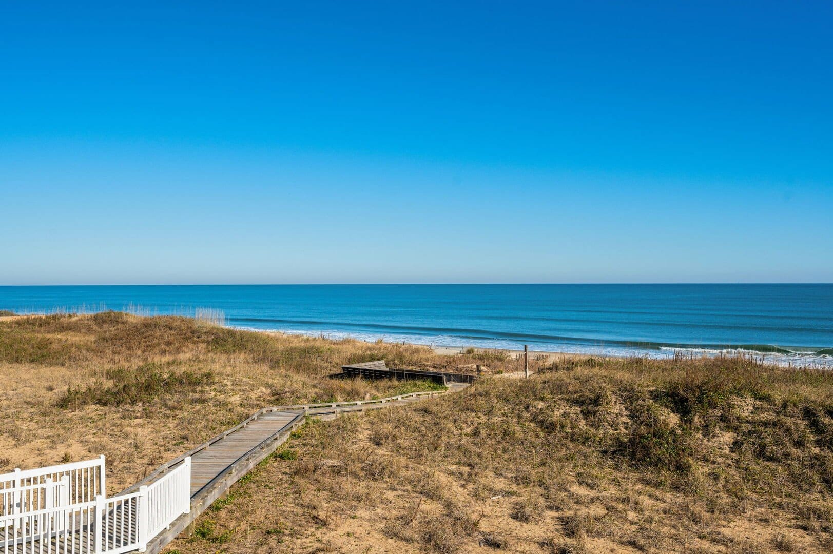 Wooden pathway leading to beach.