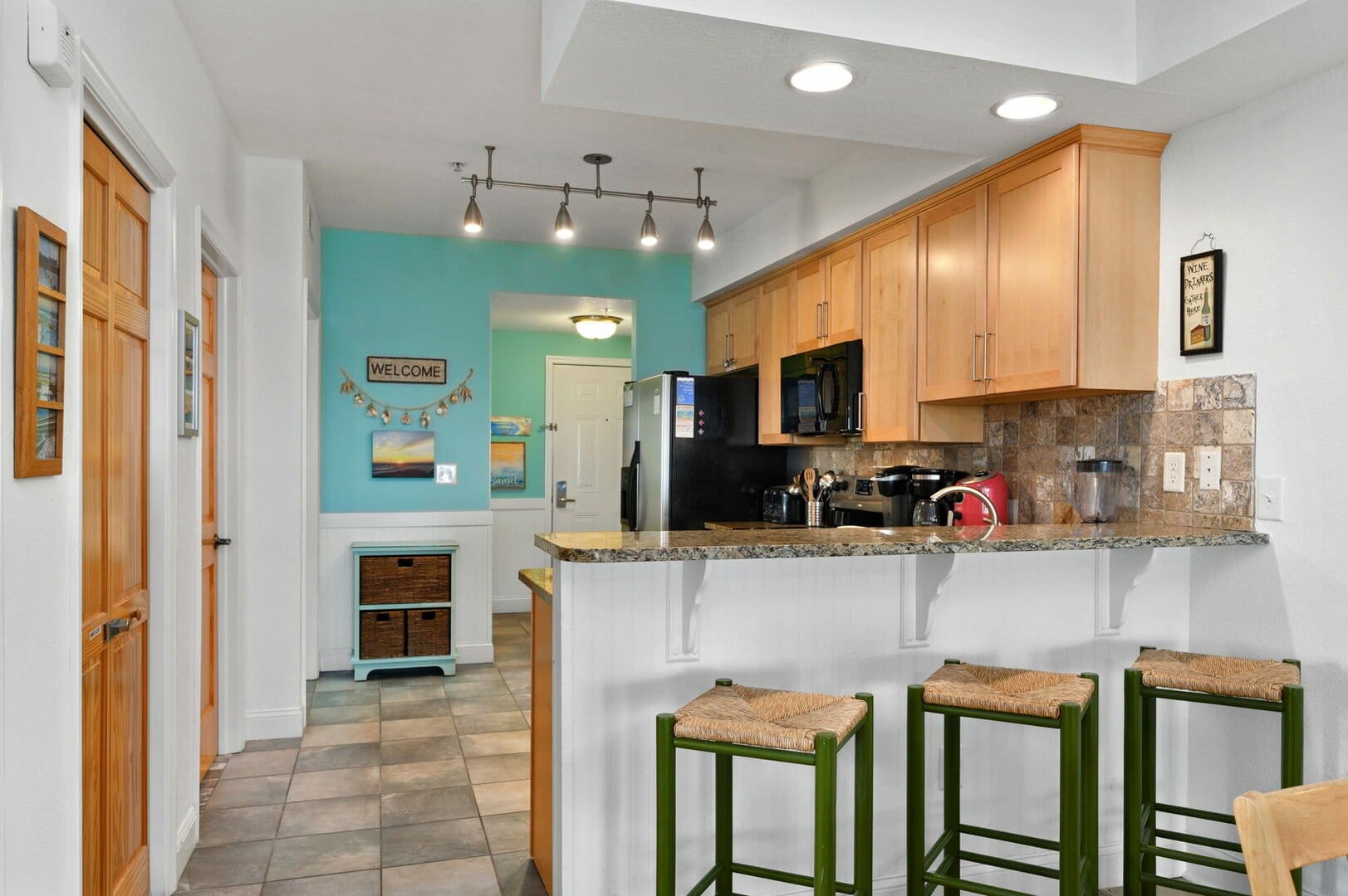 Cozy kitchen with bar stools.