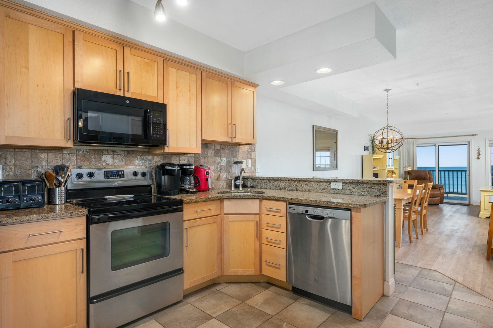 Modern kitchen with dining and oceanview.