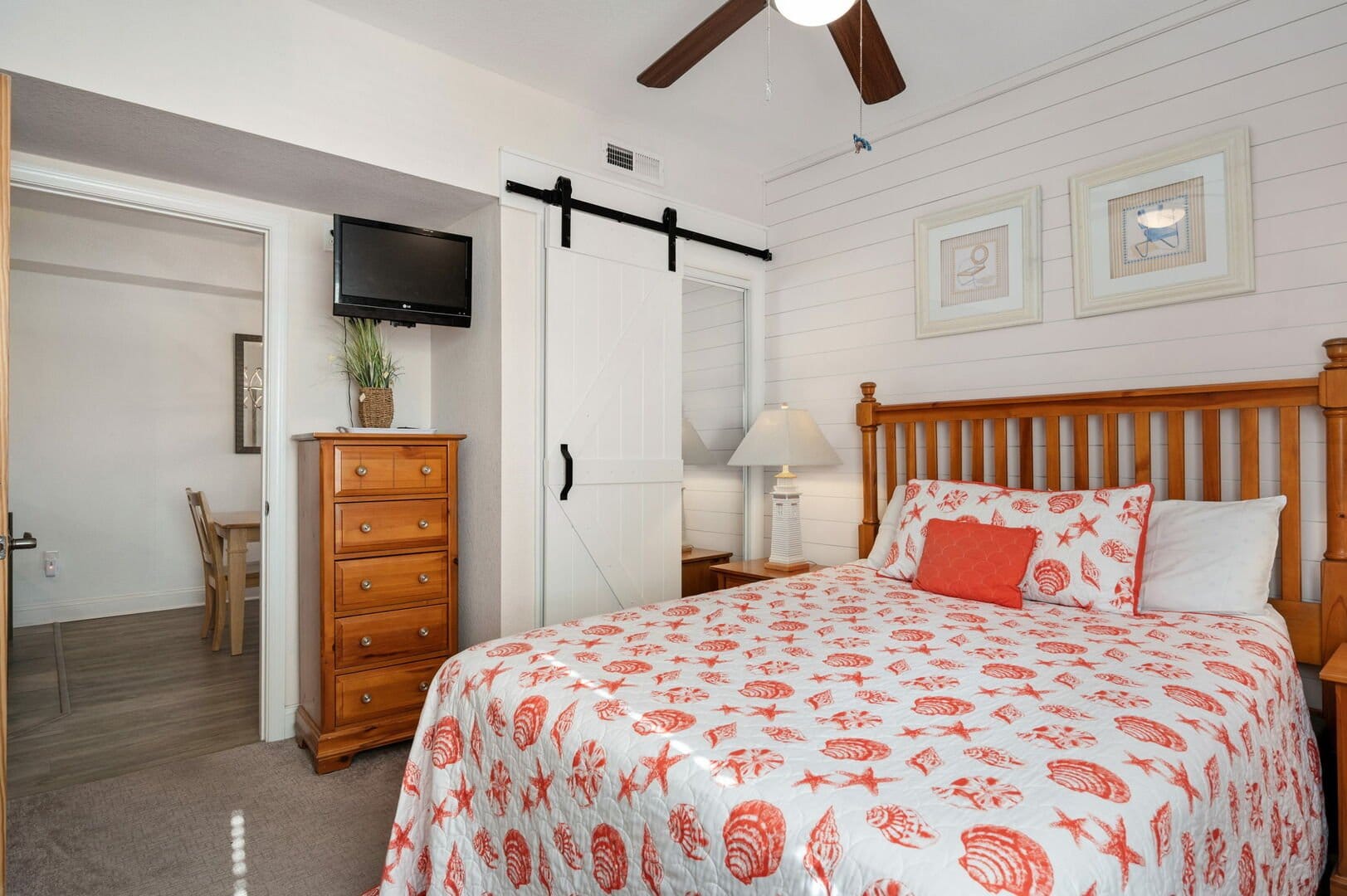 Bedroom with coastal-themed bedding.