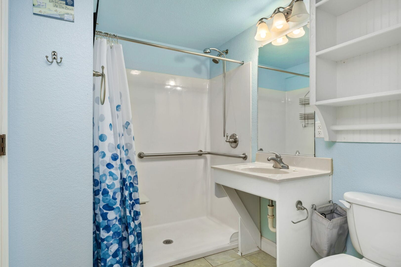 Accessible bathroom with blue accents.