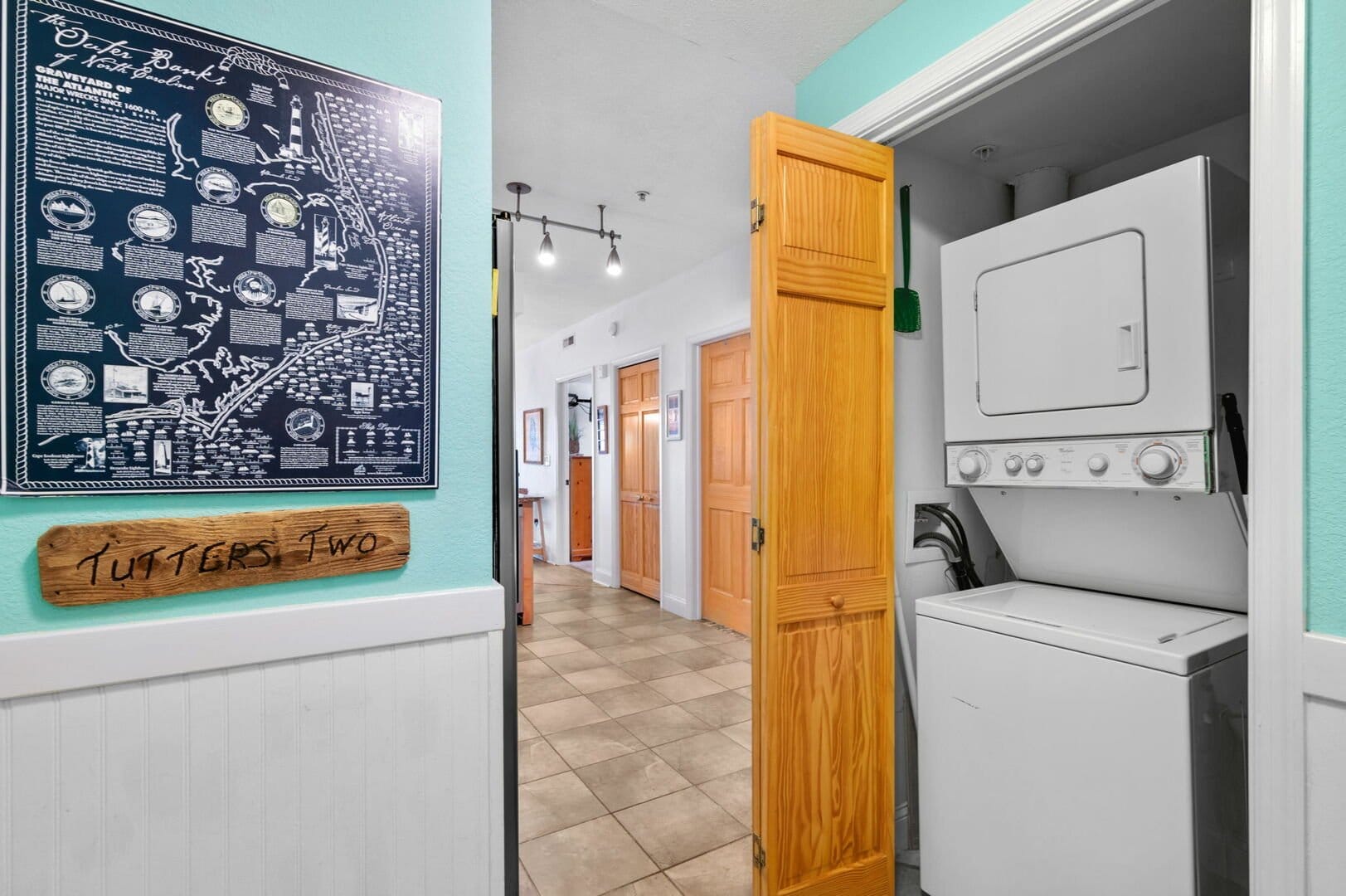 Laundry closet in hallway.