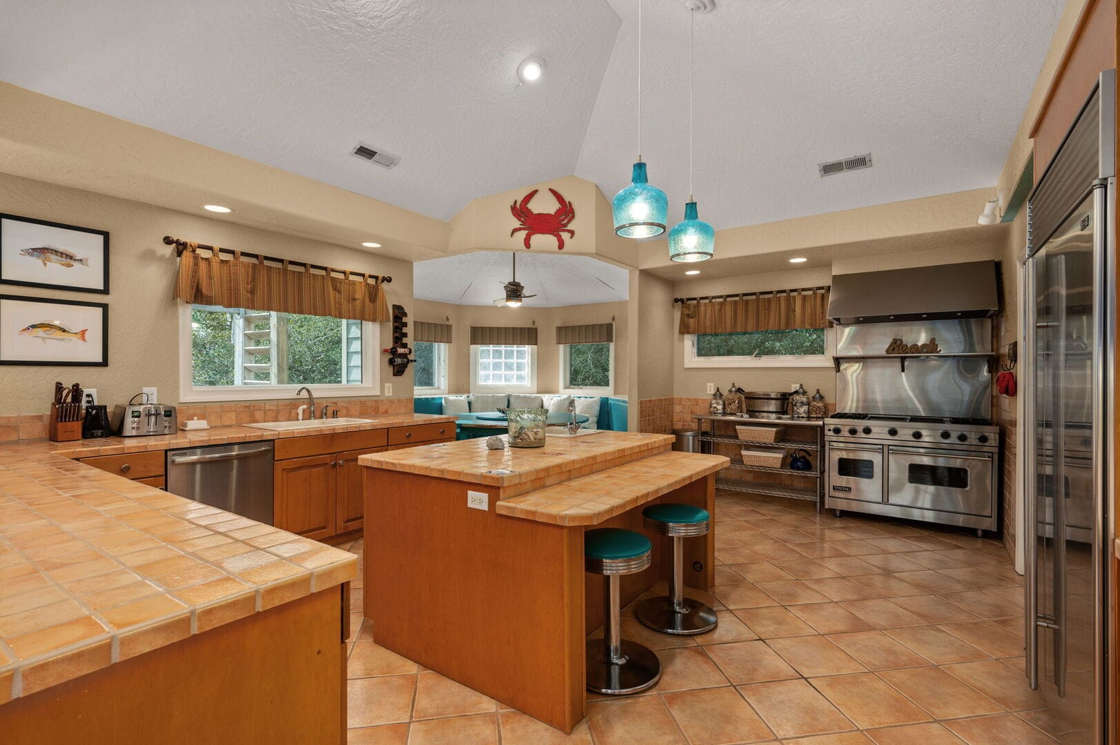 Spacious kitchen with decorative crab.
