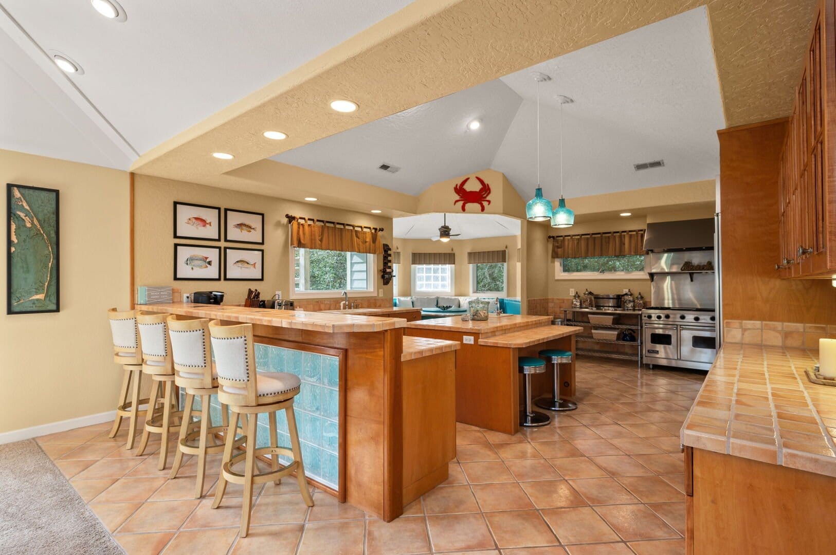 Spacious kitchen with bar stools.