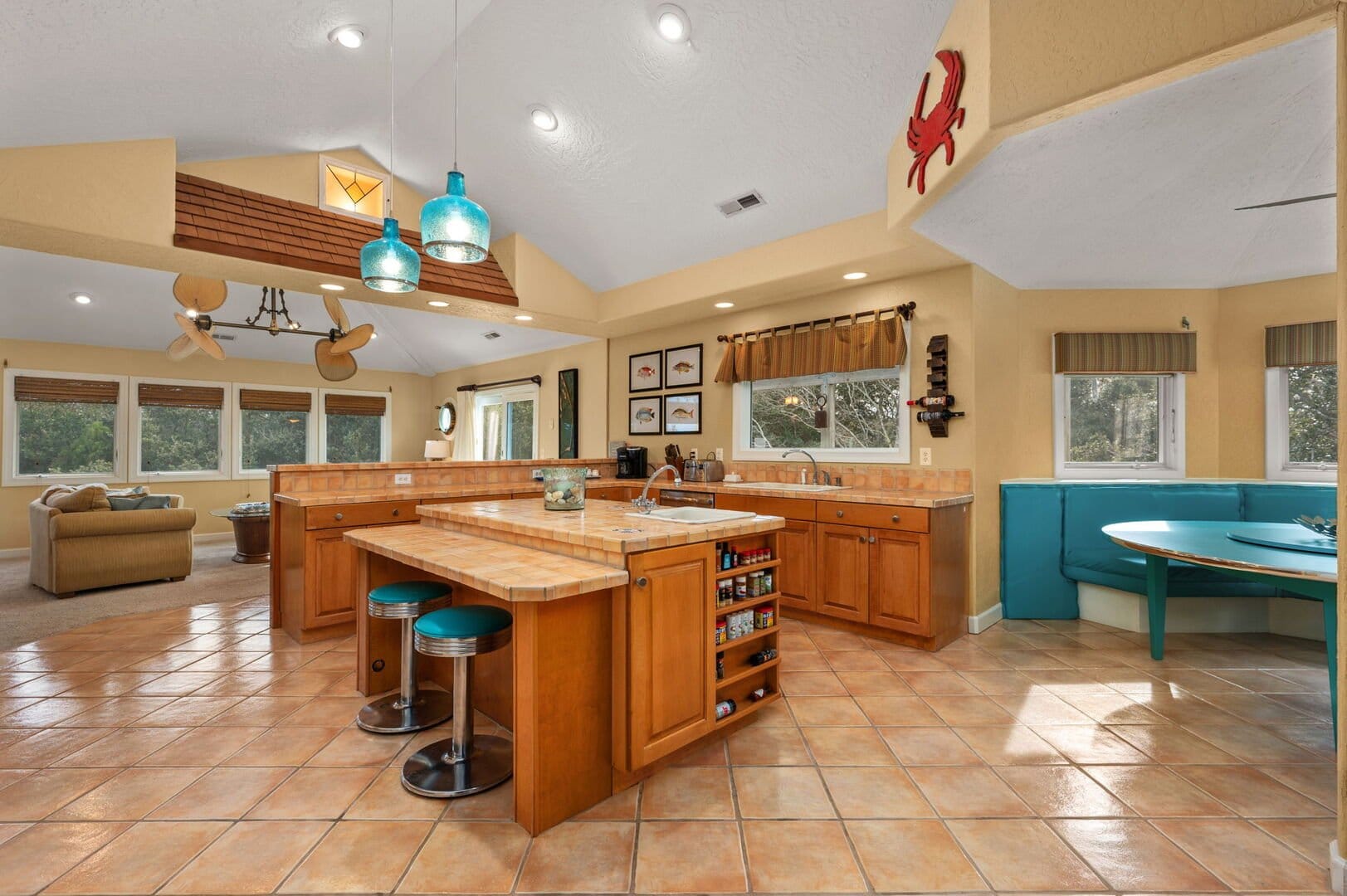 Spacious kitchen with bar stools.