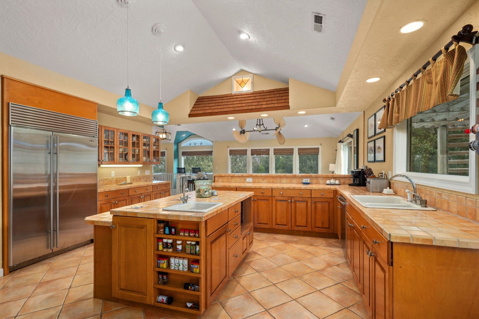 Spacious kitchen with wooden cabinets.