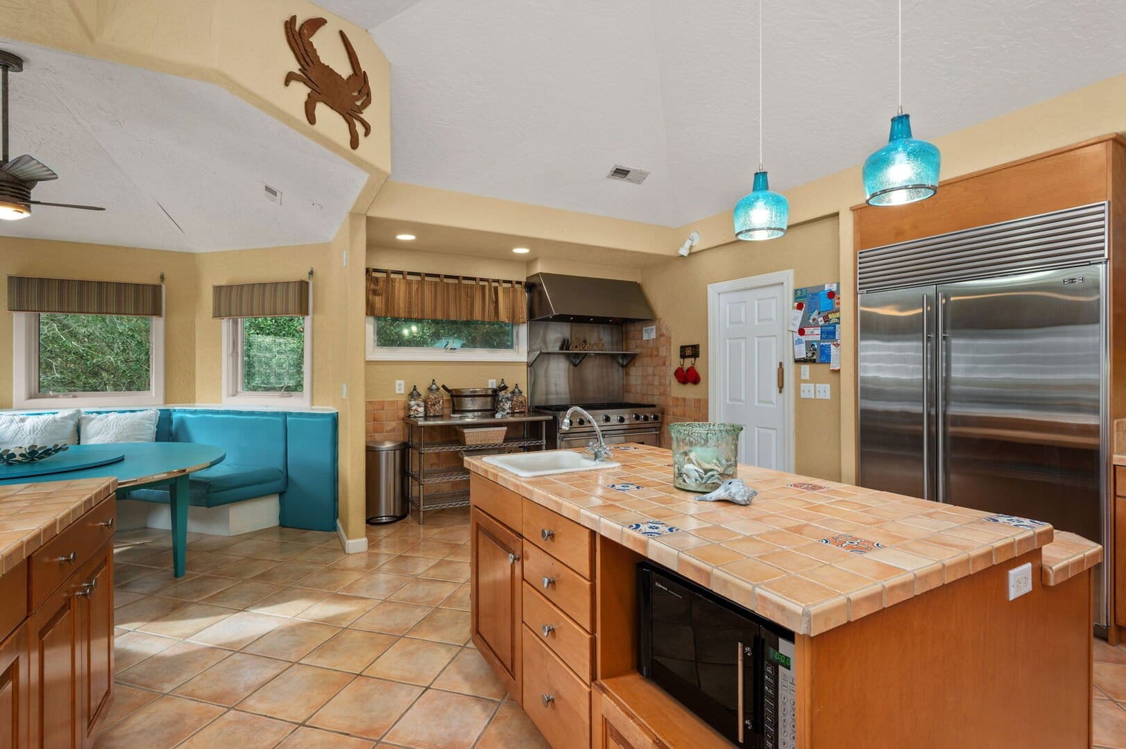 Kitchen with blue pendant lights.