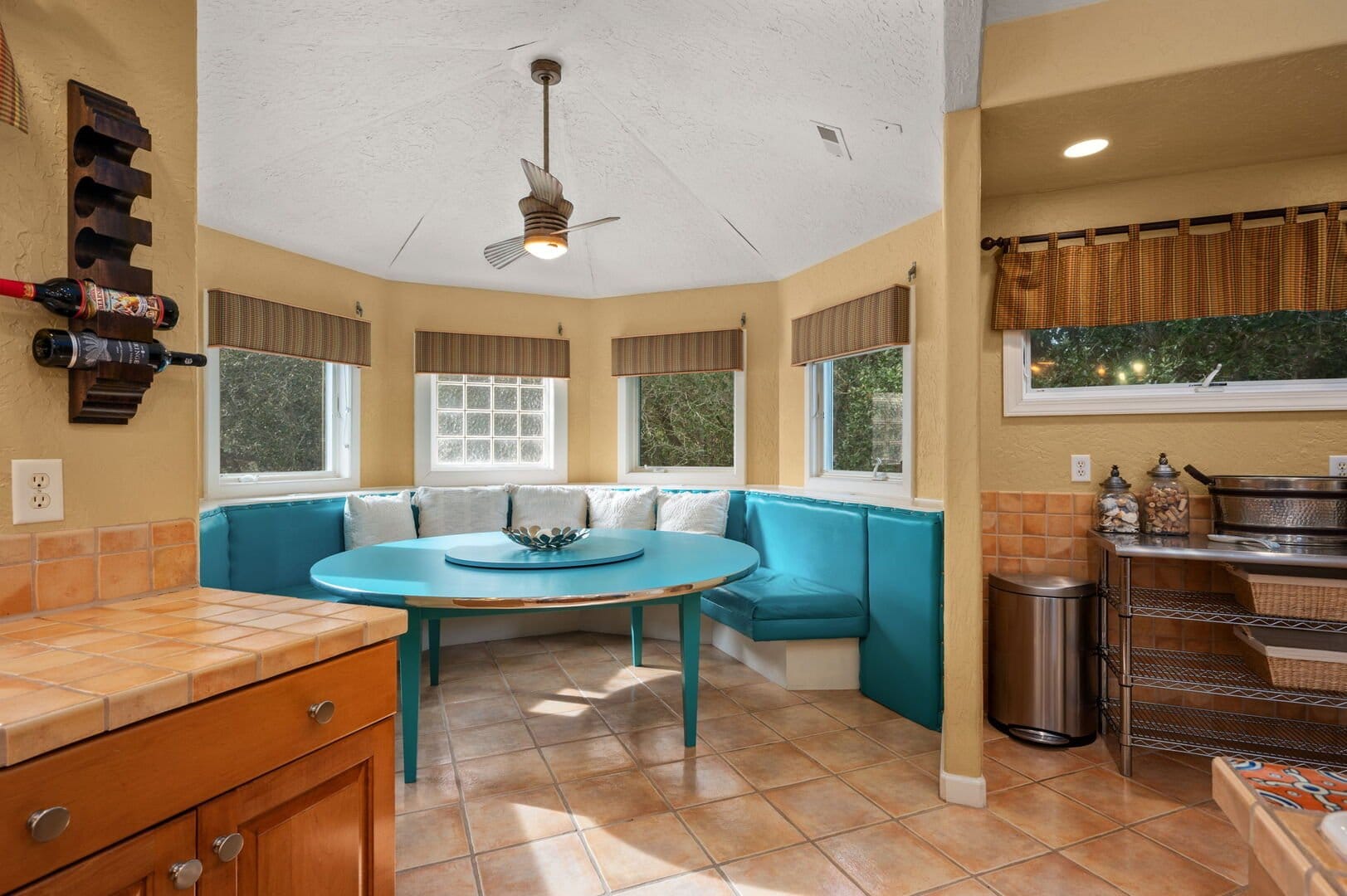 Kitchen nook with turquoise seating.