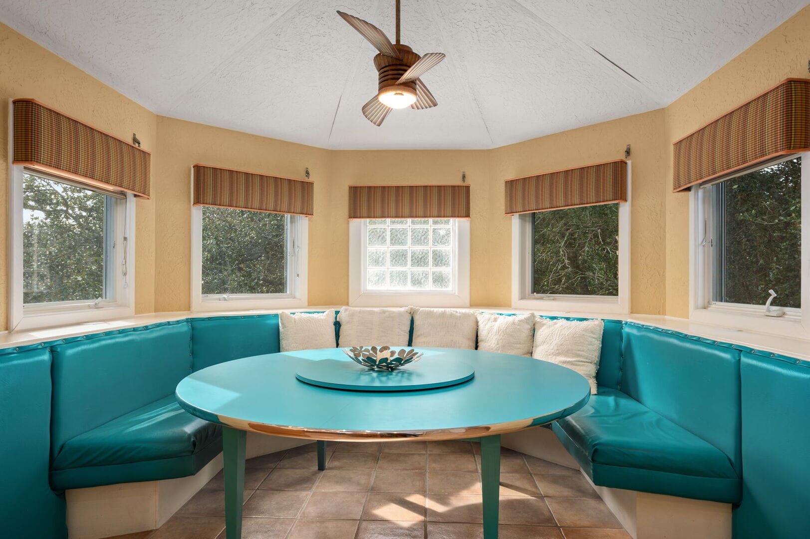 Cozy nook with turquoise seating.