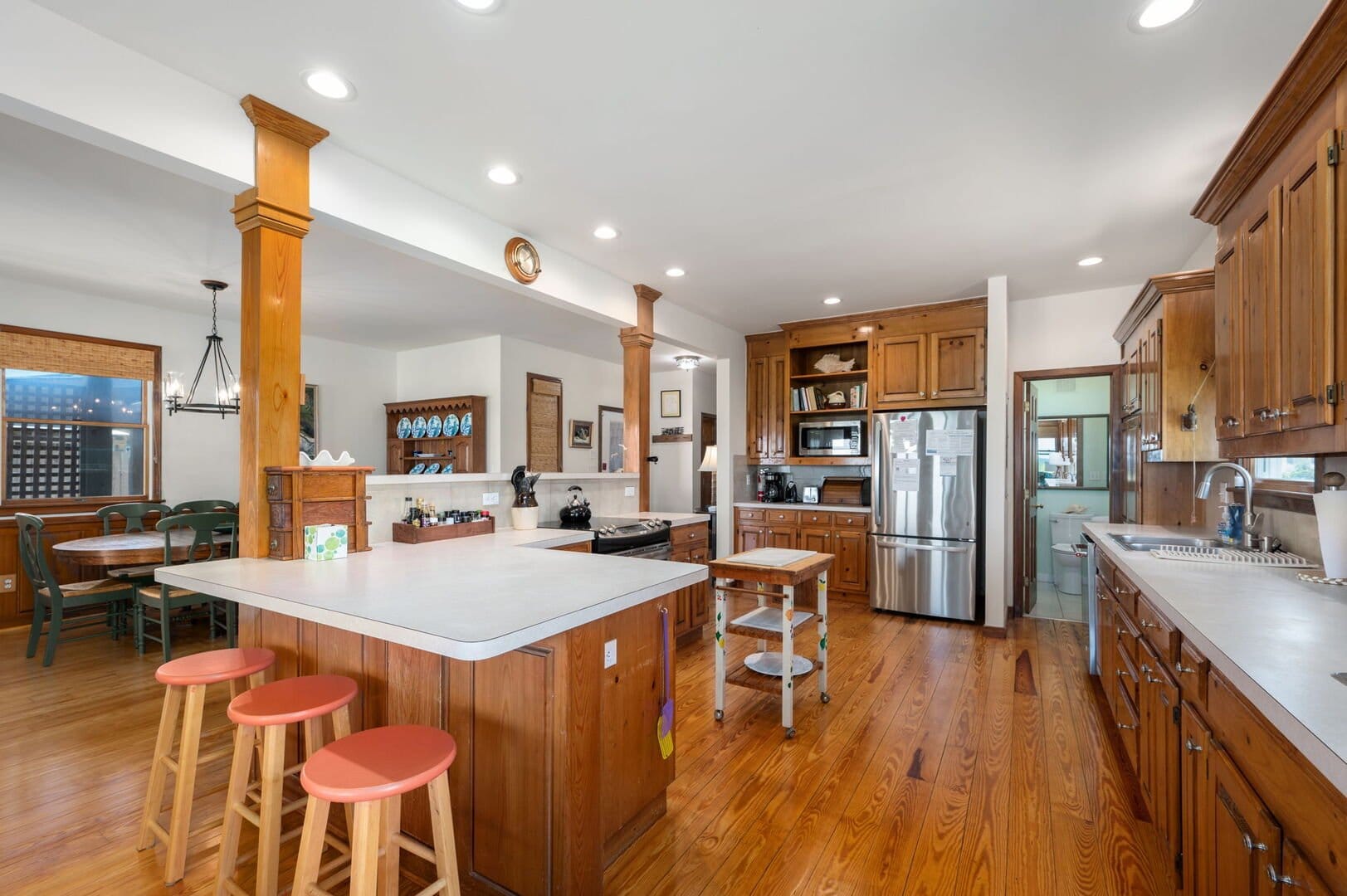 Spacious kitchen with wooden cabinets.