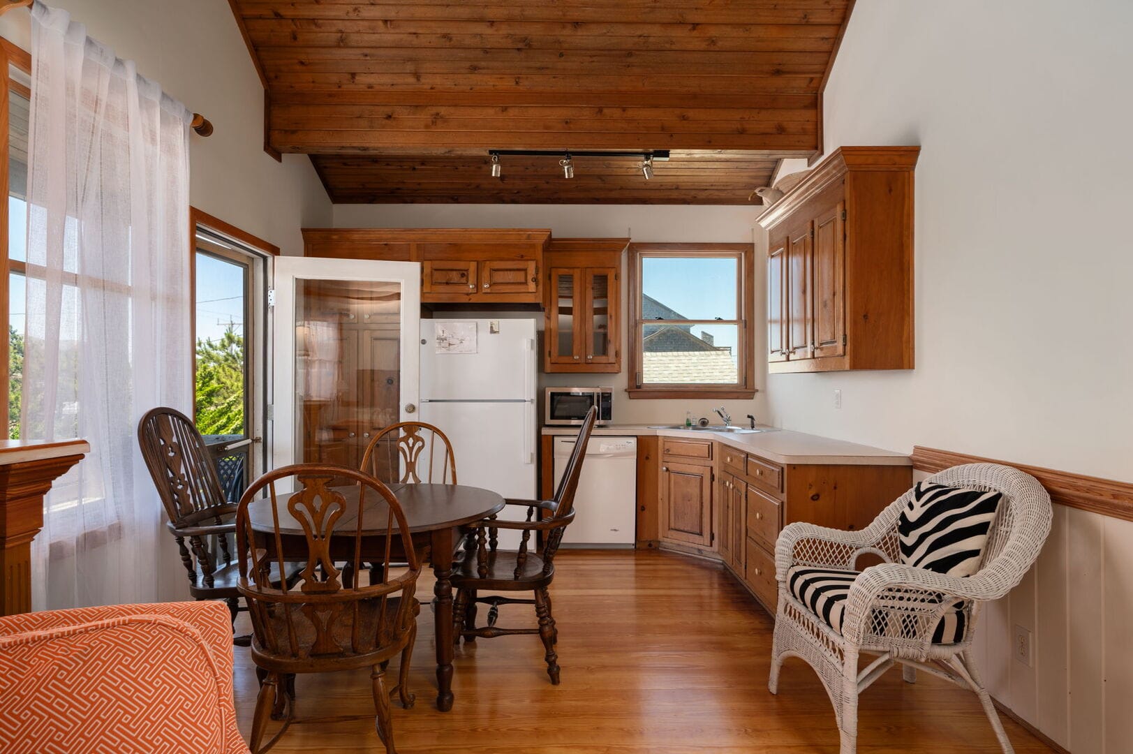 Cozy kitchen with wooden furniture.