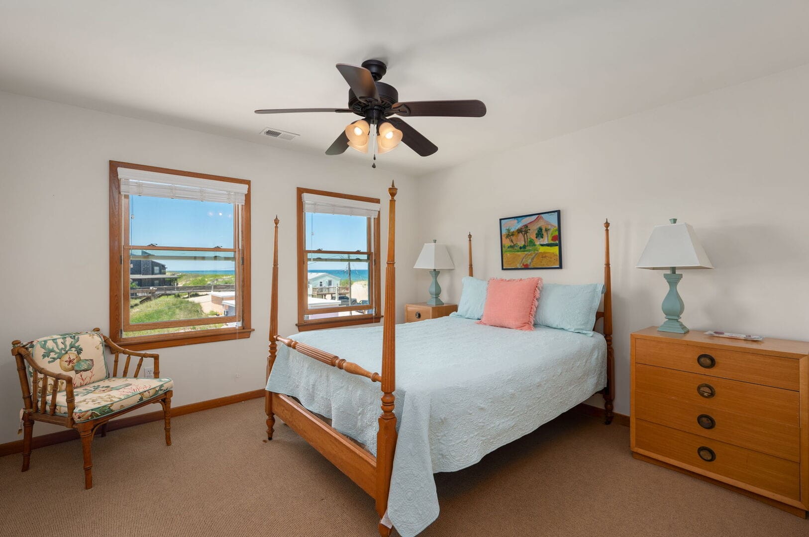 Bedroom with bed and windows.