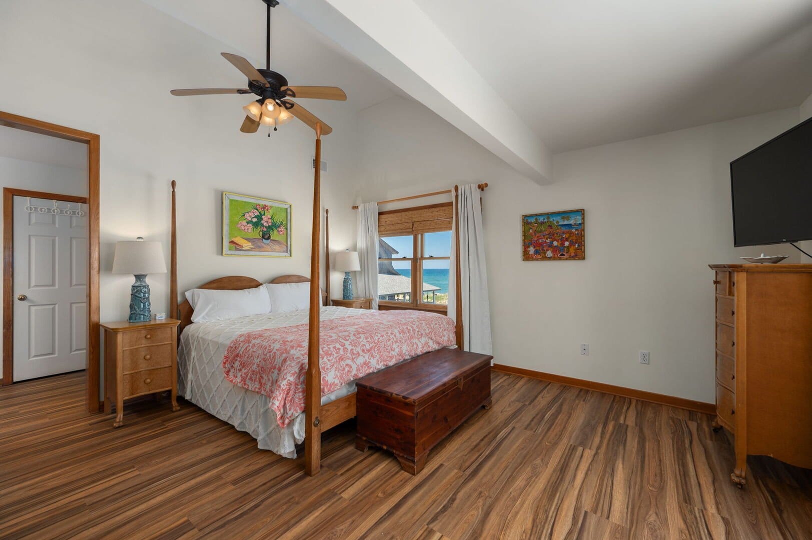 Bedroom with ocean view window.