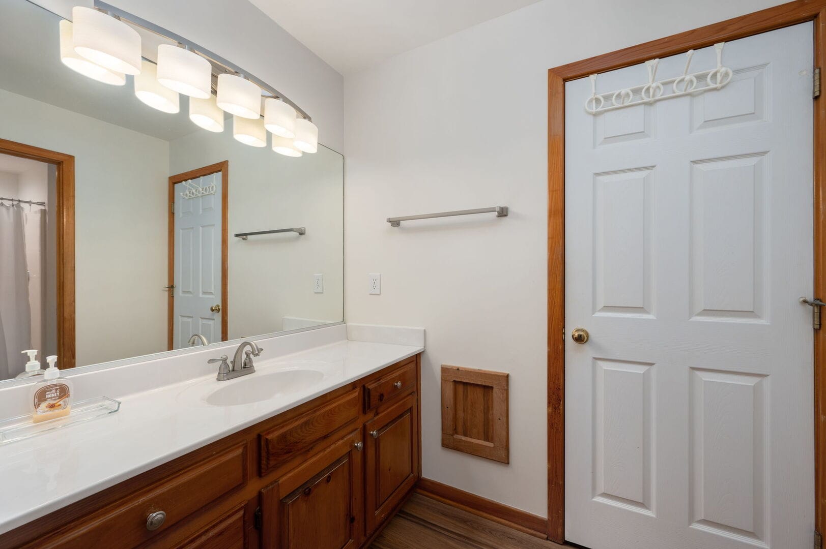 Bathroom with vanity and mirror.