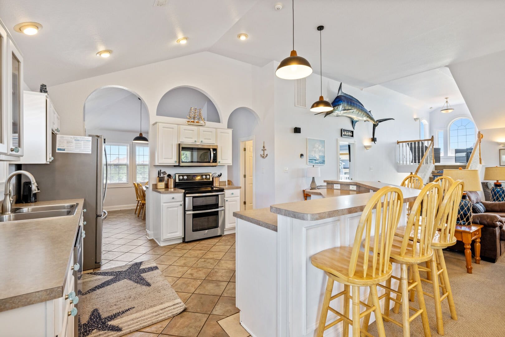 Bright kitchen with bar stools.