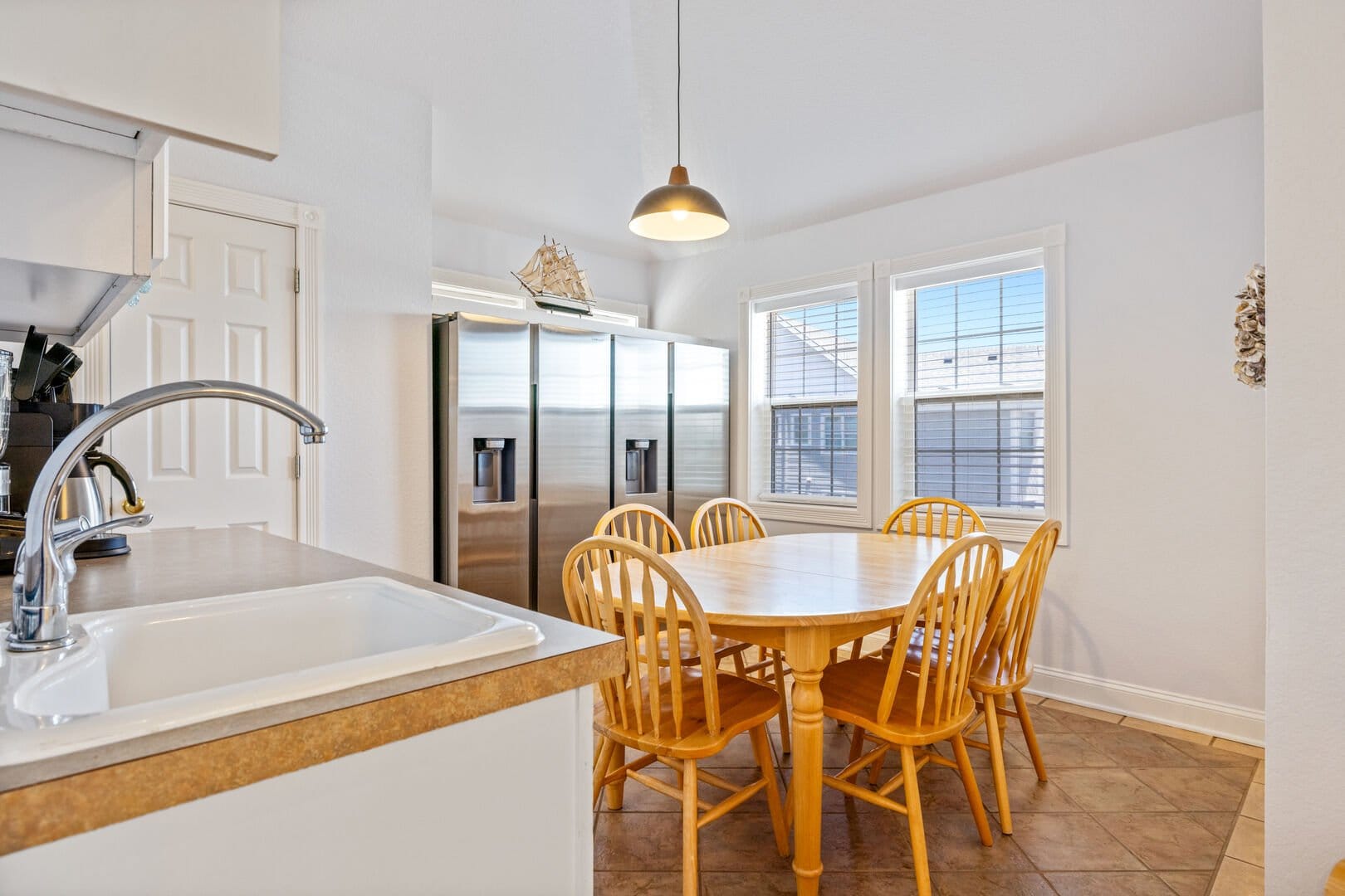 Kitchen with wooden dining table.