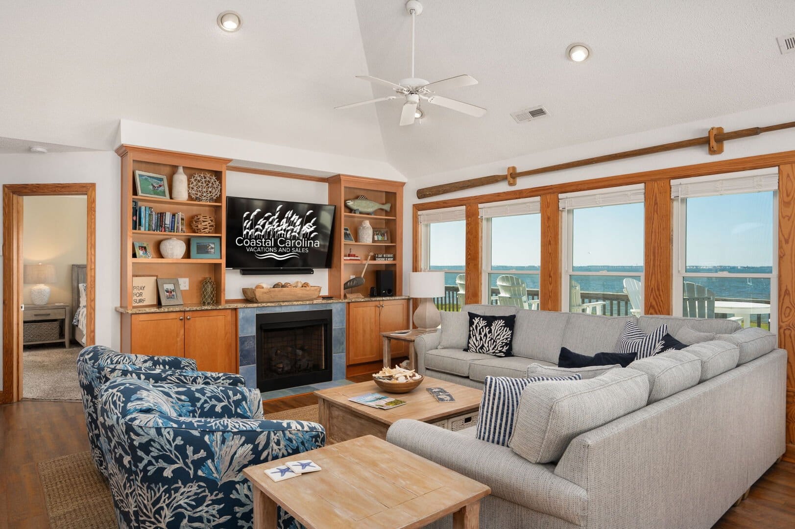 Coastal-themed living room with view.