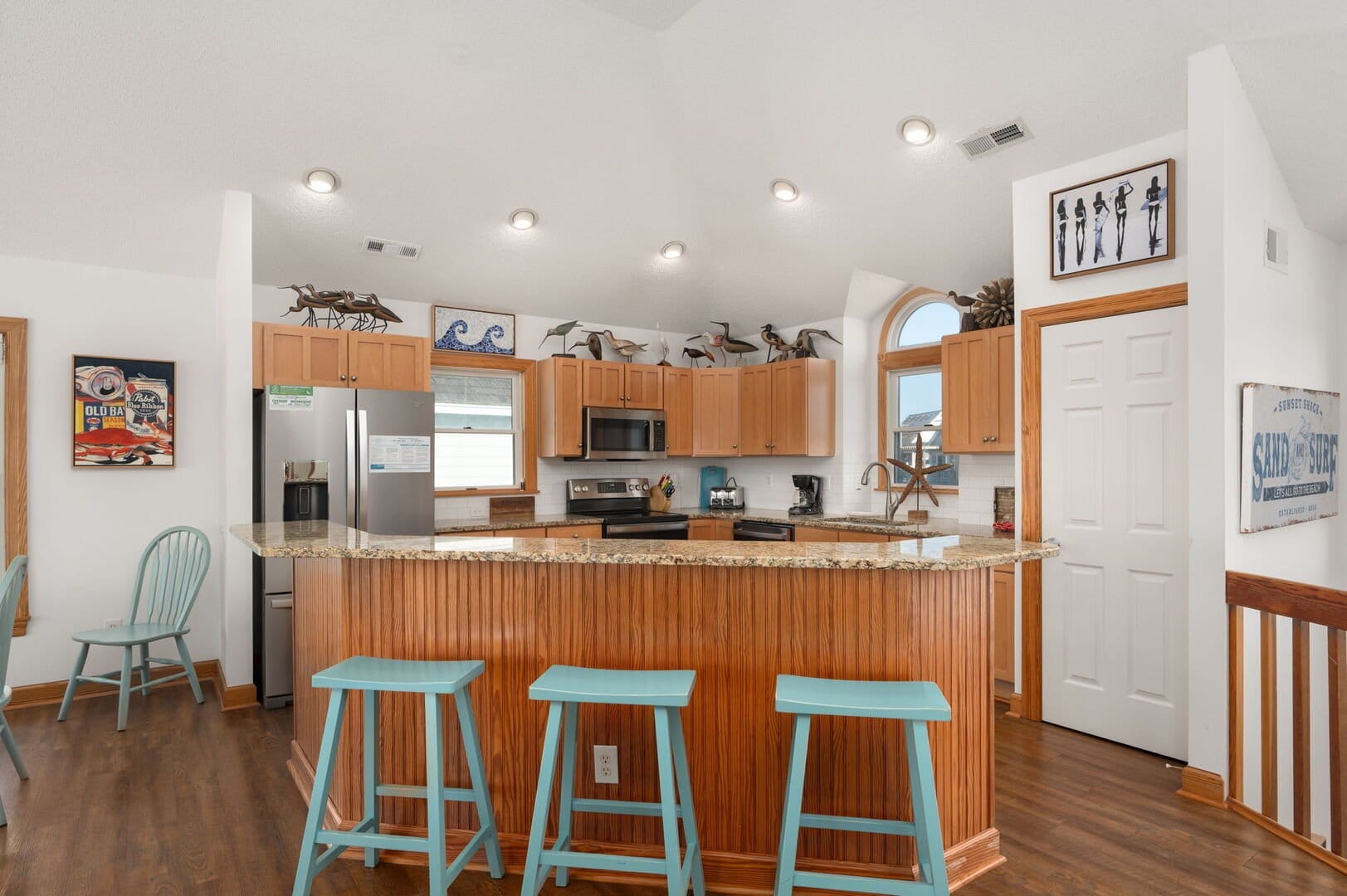 Kitchen with barstools and decor.