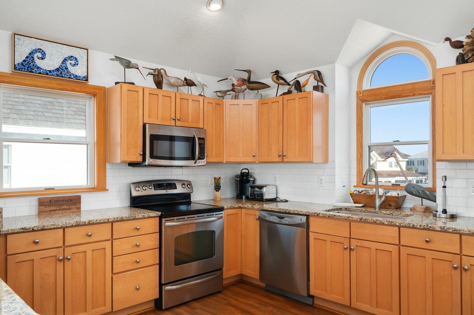 Wood kitchen cabinets, stainless steel appliances.