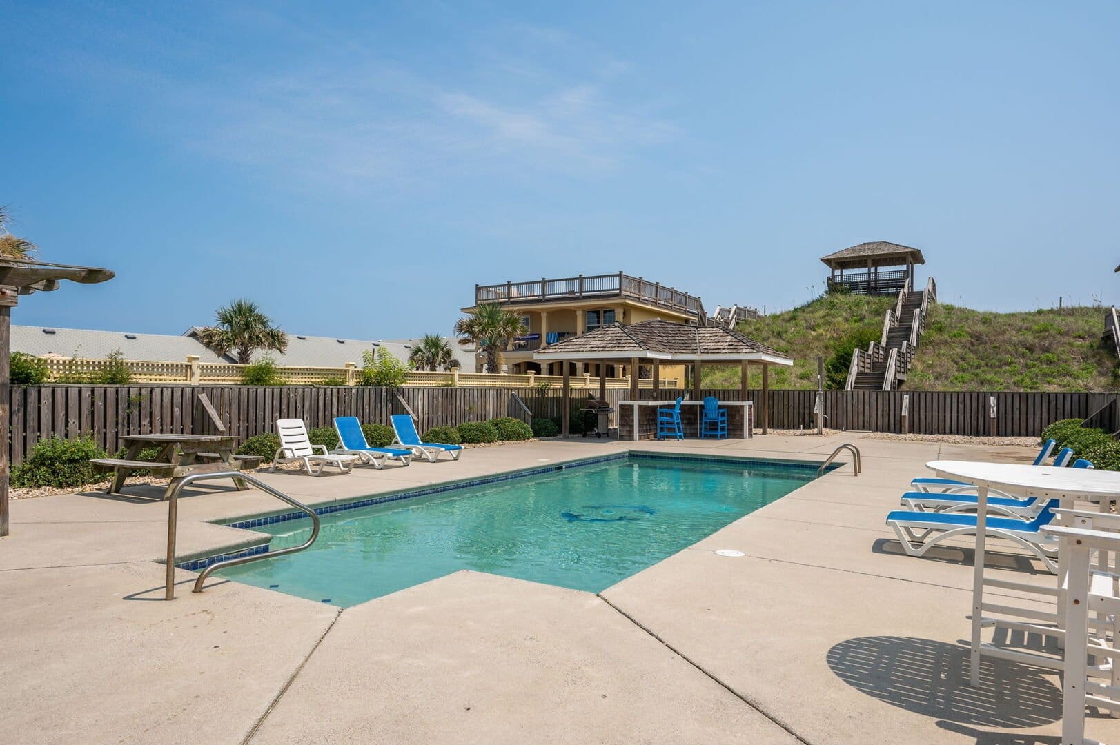 Outdoor pool with lounge chairs.