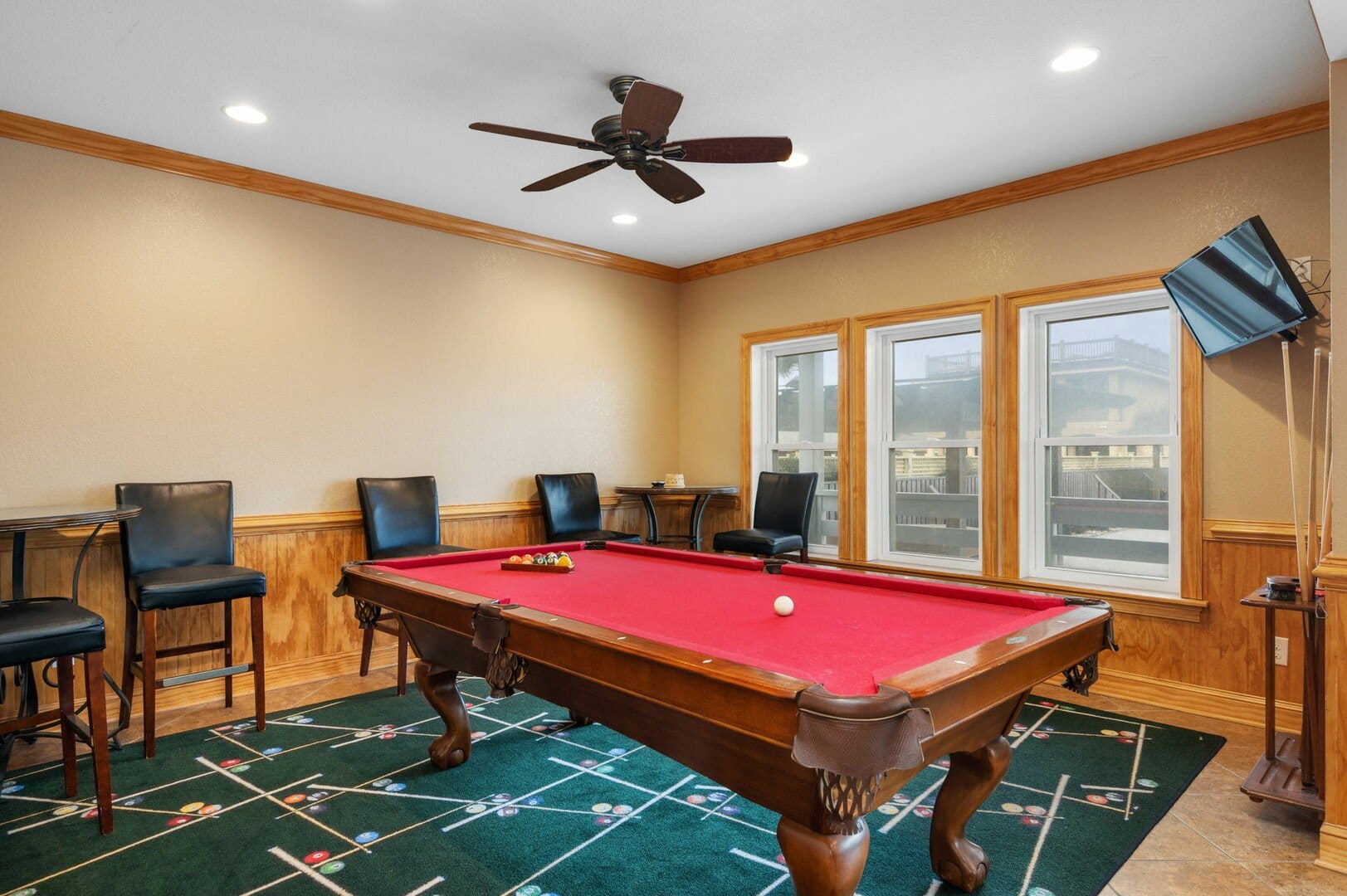 Room with red billiards table.