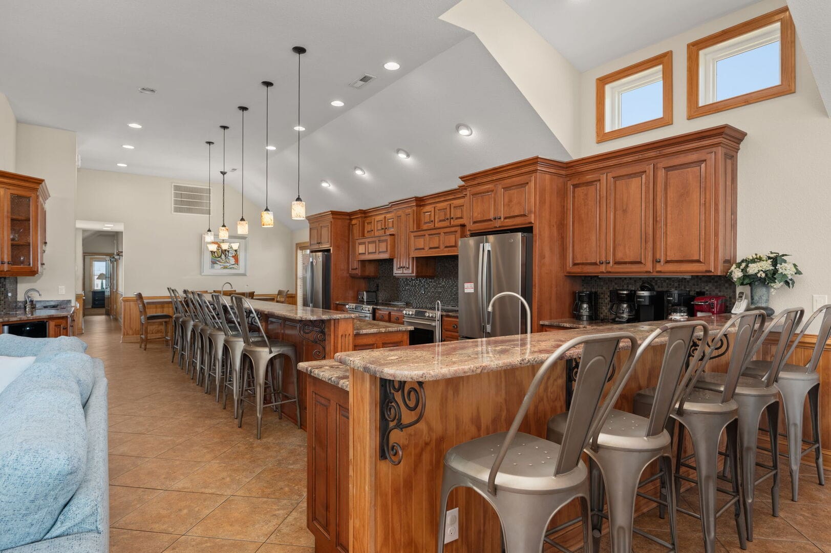 Spacious kitchen with wooden cabinets.
