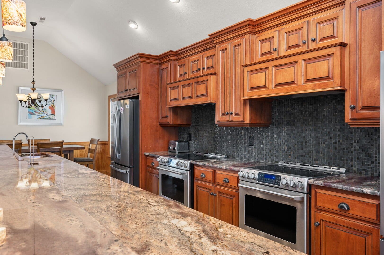 Wooden kitchen cabinets and granite countertops.