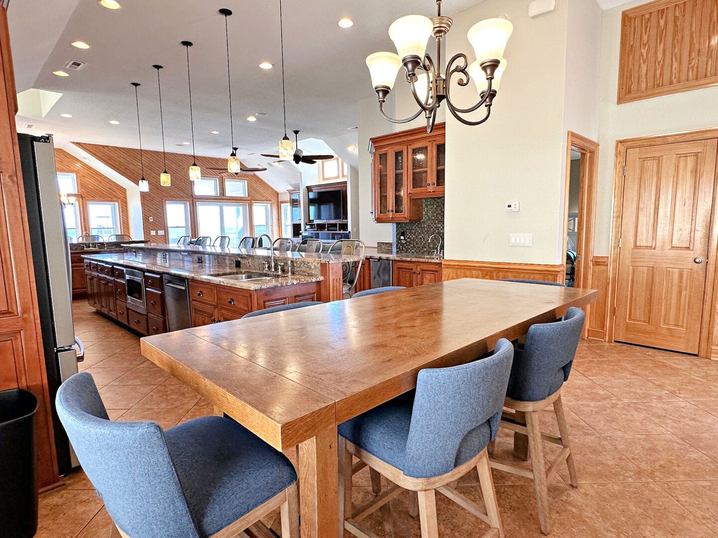 Spacious kitchen with wooden decor.
