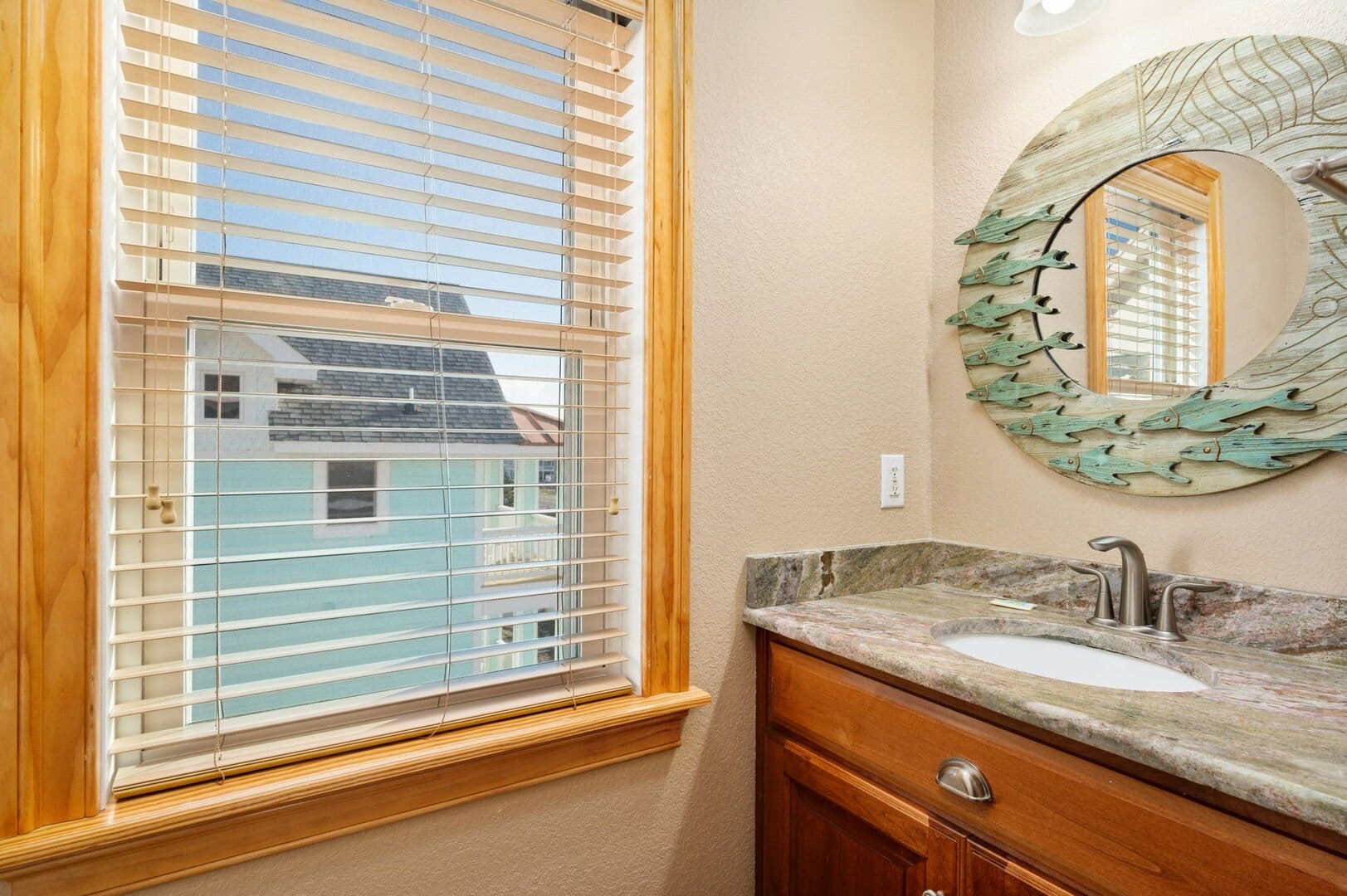 Bathroom with mirror and window.