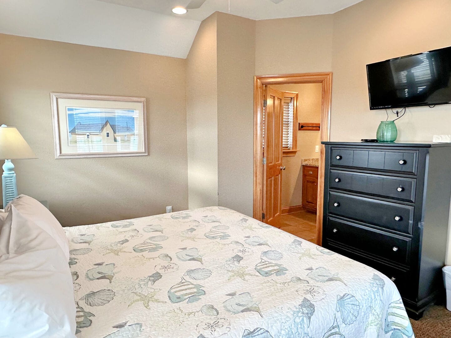 Cozy bedroom with decorative bedding.