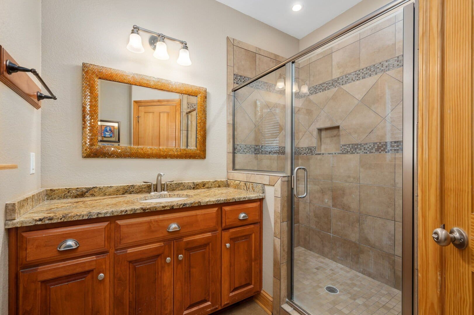 Bathroom with shower and vanity.