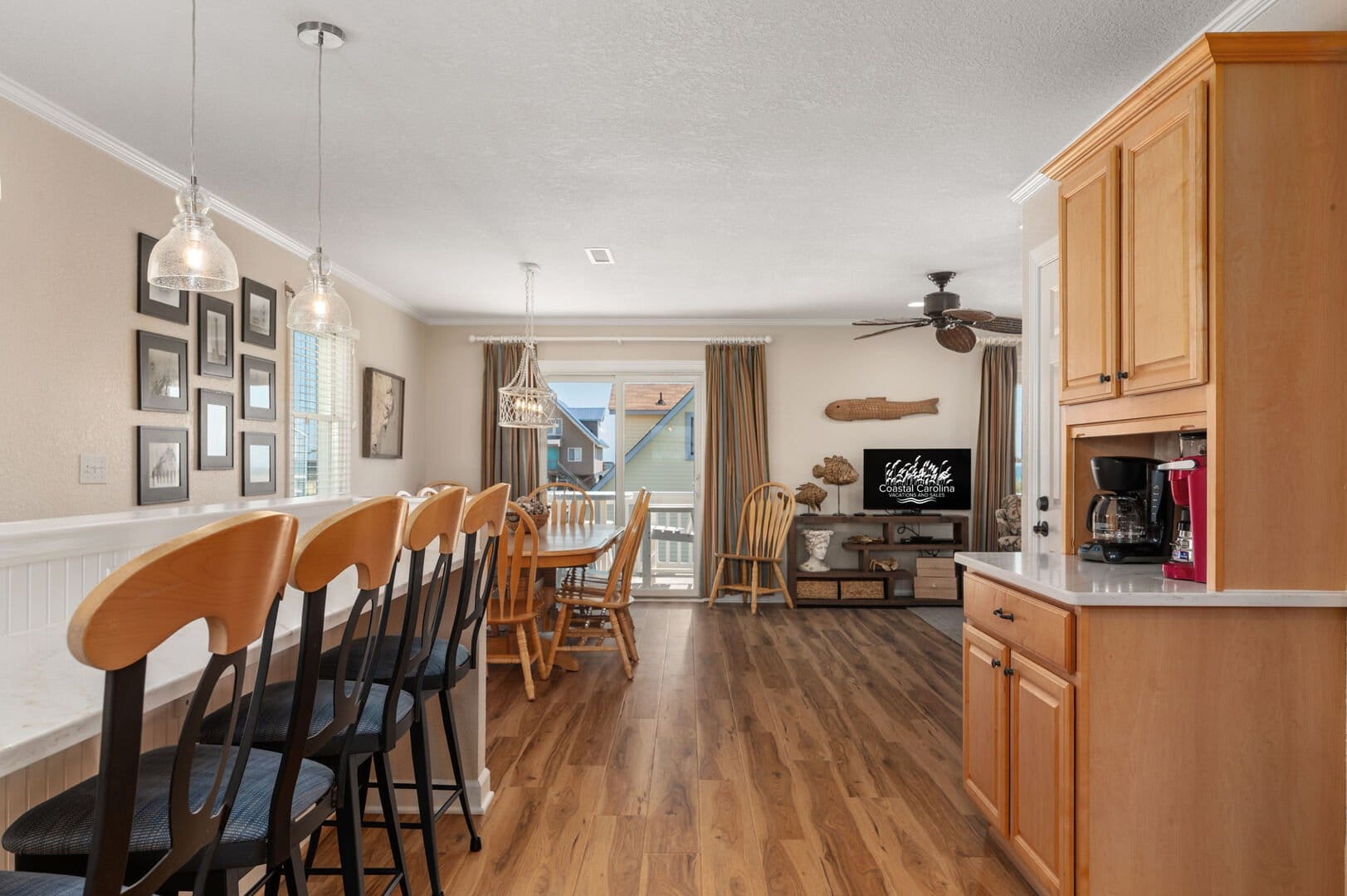 Wood-floored kitchen and dining room.
